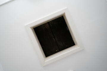 Looking up at a loft hatch