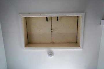 Looking up at a loft hatch