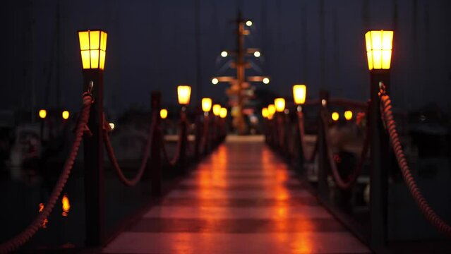 Beautiful flickering lights on a marina jetty at night