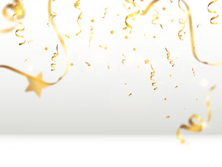 Golden confetti falls on a beautiful background. Falling streamers on stage.
