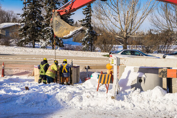 A crew works in public work storm system  renovation project