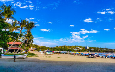 Fishing boats at the harbor beach in Puerto Escondido Mexico.