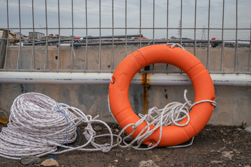 Safety flotation ring on water storage and water treatment area, for emergency action. The photo is suitable to use for safety background photography, power plant poster and electricity content media.