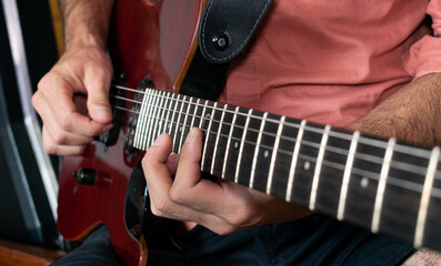 Fototapeta premium young musician plays guitar