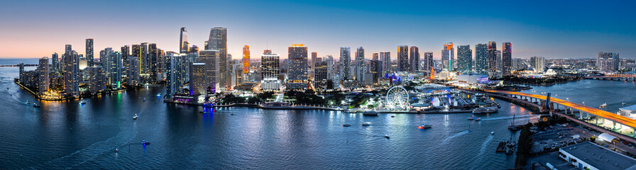 Aerial panorama of Miami, Florida at dusk. Miami is a majority-minority city and a major center and leader in finance, commerce, culture, arts, and international trade. - obrazy, fototapety, plakaty