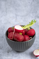 fresh radish in a plate, vertical photo