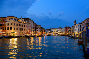 Fototapeta na wymiar Venice, Italy: Grand Canal at evening in the background with Rialto Bridge, blue hour