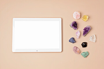 Healing chakra crystals and tablet mockup. Online application for rituals with gemstones for...