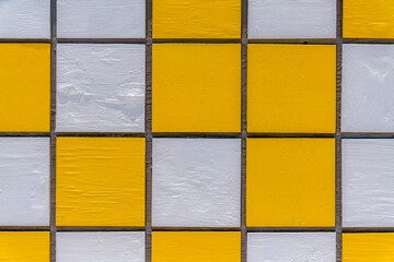Grids with painted yellow and white on a food stand at the beach in Miami, Florida. Close-up of a...
