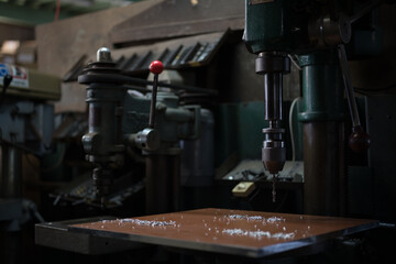 Part machining with drilling machine