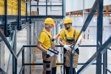 Male warehouse workers  with barcode scanner