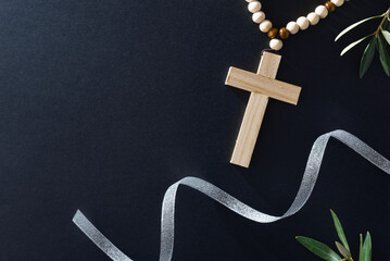 Easter religious dark background with candles cross and olive branches