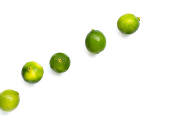 Fresh limes on white background. Copy space