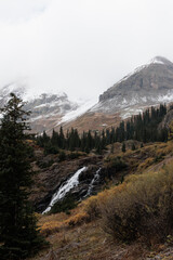 snow capped peaks with a waterfall