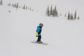 child skiing on slope
