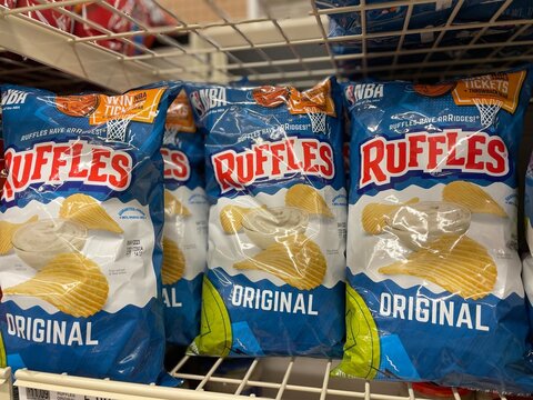 Grocery store Ruffles potato chips on a shelf