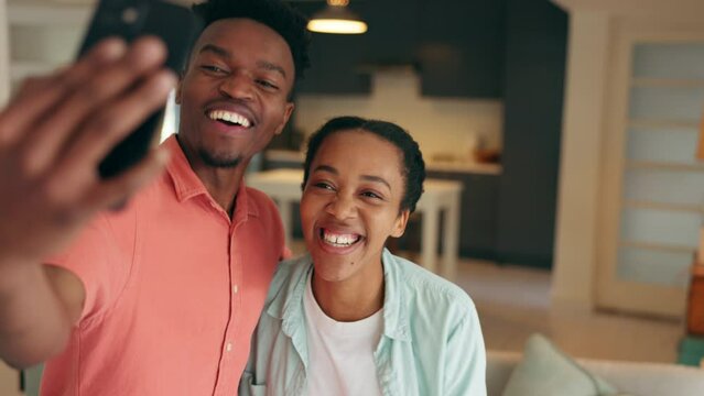 Dance, phone and couple dancing while live streaming and recording on social media app in an apartment. Influencer, content creator and happy black woman love filming trendy videos with man at home
