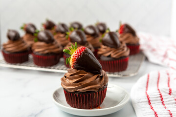 Chocolate Cupcake with Chocolate Frosting Topped with a Chocolate-Dipped Strawberry