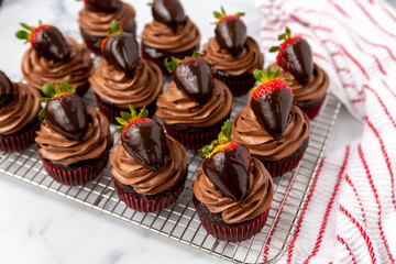 Chocolate Cupcake with Chocolate Frosting Topped with a Chocolate-Dipped Strawberry