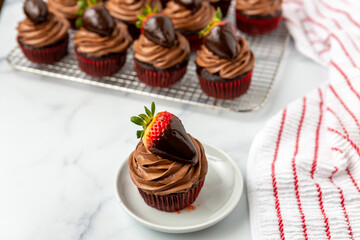 Chocolate Cupcake with Chocolate Frosting Topped with a Chocolate-Dipped Strawberry