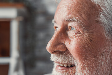 Handsome older man smiling staring at camera feels happy, close up face view. Senior advertise professional dental clinic, teeth repair and check up services, medical insurance cover for elder concept