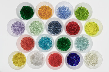 Colored plastic resins in test glasses in laboratory
