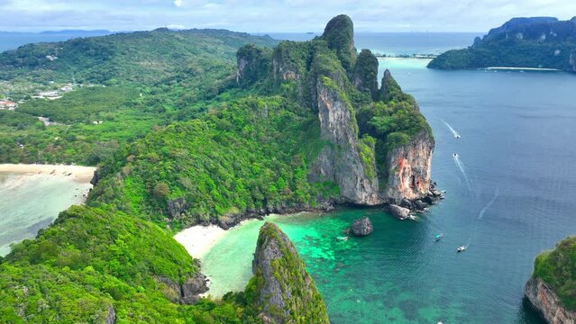 turquoise lagoon in Phuket or Krabi resorts in Thailand, paradise tropical beach aerial view, beautiful Thai beach with cliffs, bay on Phi Phi island