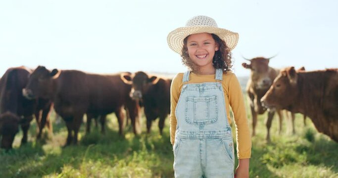 Happy child, farming and fun learning to care for animals, cows and cattle during nature travel in countryside. Portrait of girl kid smiling and happy enjoying rural beef farm life and sustainability