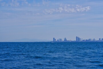 Building city next to the ocean and beautiful sky