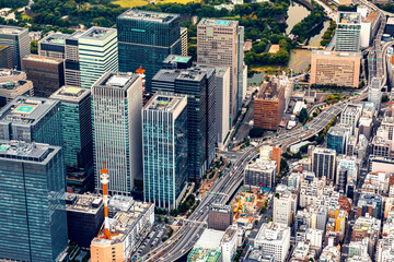 Aerial view of skyscrapers and expressways in Marunouchi district, Tokyo Japan