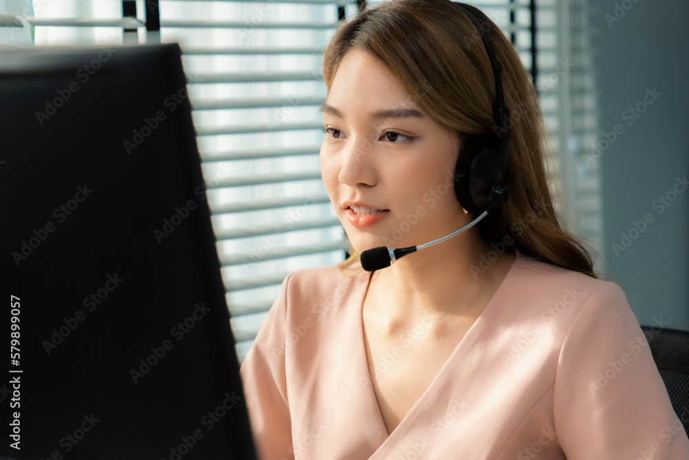 Aufkleber competent female operator working on computer and while talking with clients. concept relevant to bo