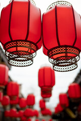 Red Chinese lanterns hanging in a street, Luodai, Chengdu, Sichuan province, China - 579900695