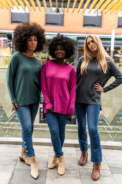 Multiracial women sharing free time in coworking space