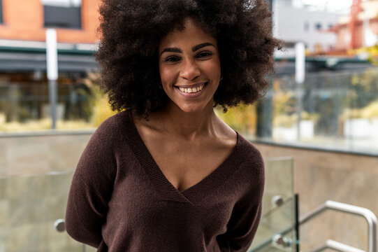 Self-confident woman with afro during day off 