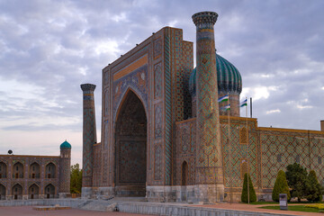 Facade of the ancient Sherdor madrasah close-up on a cloudy September evening. Samarkand, Uzbekistan