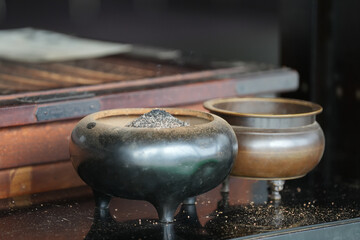 ceramic incense bowl used for praying in Japanese temple.