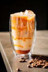 iced coffee with caramel on table