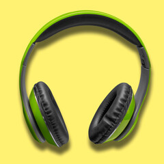 Green headphones on a yellow background. Music.
