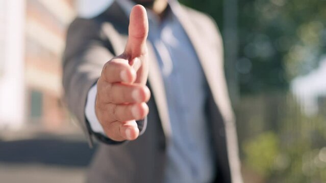 City, professional and businessman with handshake gesture for agreement, deal or partnership. Corporate, outdoor and male employee with shaking hands offer in town for greeting, welcome or thank you.