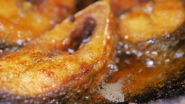 close up of cooking ilsha fish in deep oil 