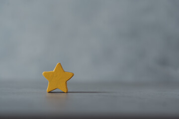One wooden yellow star shape with an empty spec. Cute star