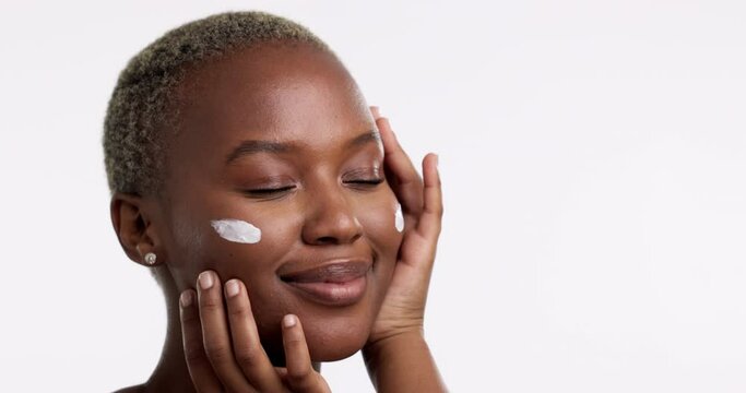 Beauty, Skincare And Lotion With A Model Black Woman In Studio Isolated On A White Background For Antiaging. Face, Skin And Moisturizer With An Attractive Young Female Indoor To Apply Treatment