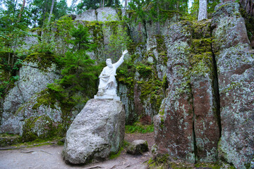 Vainamoinen playing on a kantele - statue of the hero of the epic Kalevala, Park Mon Repos, Vyborg,...