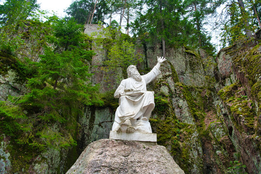 Vainamoinen playing on a kantele - statue of the hero of the epic Kalevala, Park Mon Repos, Vyborg, Russia