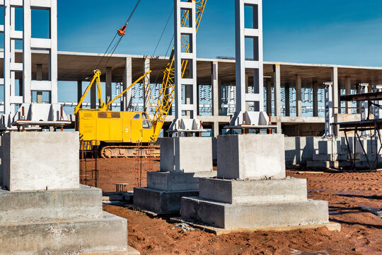 Monolithic reinforced concrete foundation or grillage for the construction of a modern power plant. Powerful columns and grillages at the construction site. Reinforced concrete monolithic structures.