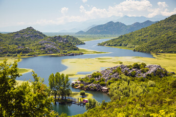 Fototapeta premium Perfect summer scene of the fishermen settlement Karuc. Skadar Lake National Park, Montenegro, Europe.