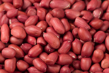 red peeled peanuts texture background.