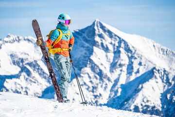 Mountaineer backcountry ski walking ski alpinist in the mountains. Ski touring in alpine landscape...
