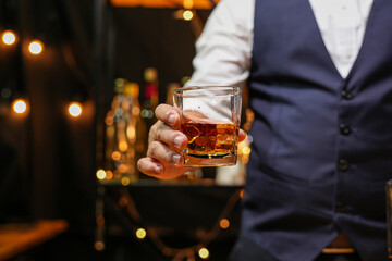 Bartender pouring Whiskey, on  bar,