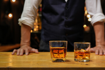 Bartender pouring Whiskey, on  bar,